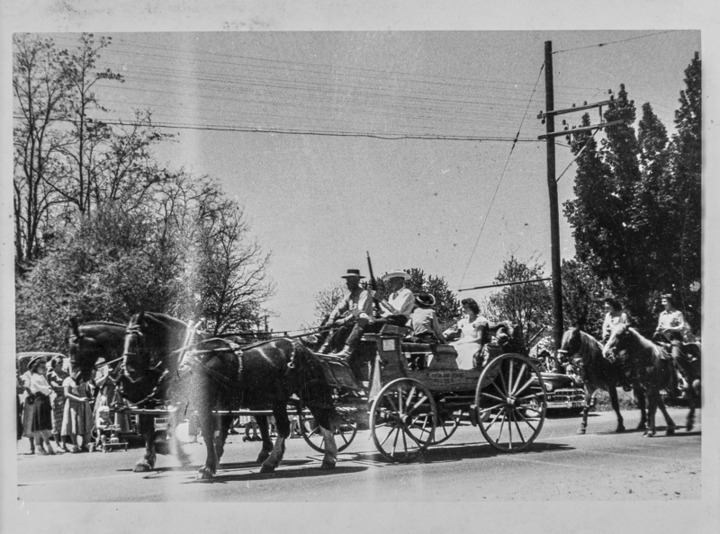 A carriage being pulled by a team of horses.