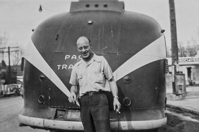 Photograph of Swede Boice in front of a bus