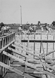Men working on the basement for Alice's house