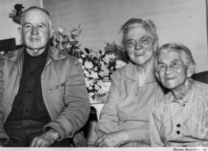 3 older friends who are posing for a photo, one of them being Catherine Harris.