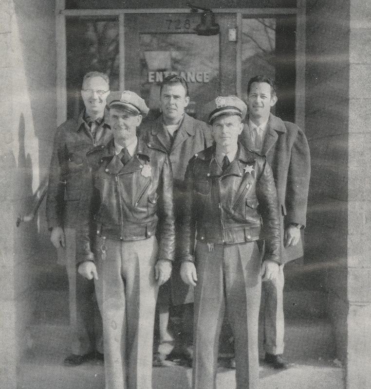 First Row, left to right: Steve J. McGill (Meridian Chief of Police), Gene D. Hiner (officer); Second Row, Left to Right: Herald J. Cox (Meridian City Clerk), Don M. Storey (Mayor), Dean Mayes (Police Commissioner)