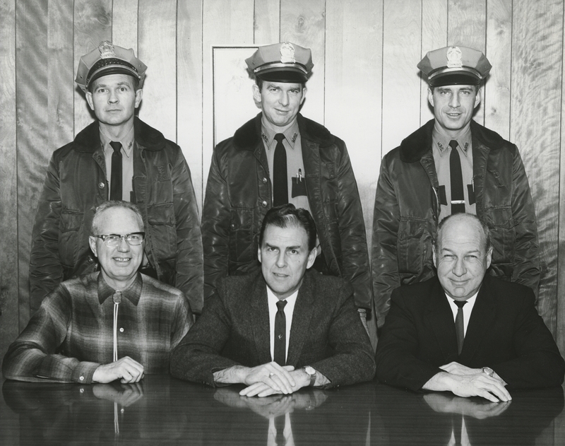 Top left to right: Chief Gene Hiner, Patrolman Richard Brumble, Senior Patrolman Charles Stuart; Bottom left to right: Herald Cox (city clerk), Don Storey (mayor), Wayne Skiver (Police Commissioner); circa 1965