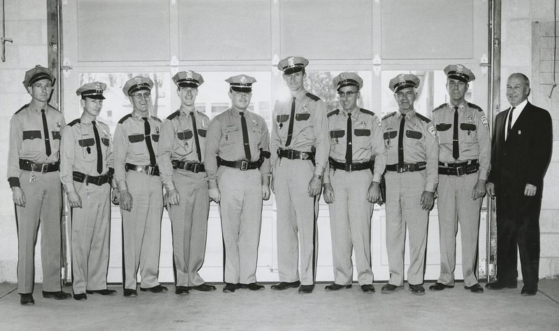 Meridian Auxiliary Police were praised by the city for their outstanding service at community events and the Meridian Times used this photo shoot; Left to right: Gene Hiner (police chief), Kenneth Smith, Neal Hudson, Robert Metich, Don Sneddon, Lowell Gass, Wally Everist, Ted Dennis, Roy Wood, Wayne Skiver (Police Commissioner)