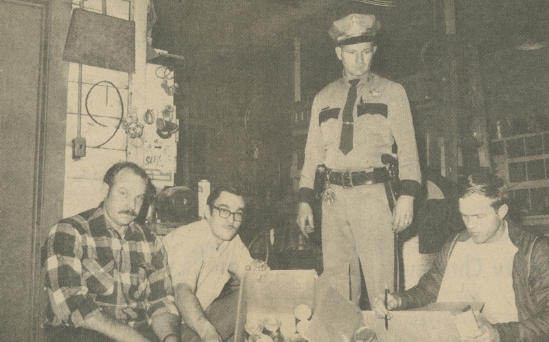 Police Chief Gene Hiner helps the Meridian Jaycees with Merry Christmas boxes of food to be donated to community families; Left to right: Larry Cantrell, Jerry Gould, George Cuttlers