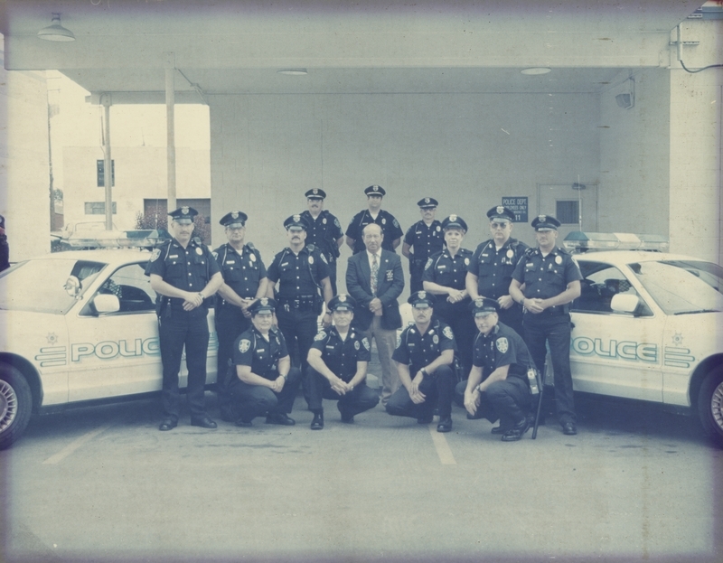 Back Row: Kevin Robertson, Bill Musser, Gene Trakel; Middle Row: Eric Strolberg, Bill Volker, Rick Murphy, Chief Bill Gordon, Kathy Kirby, Steve Bradley, Brent Crystal; Front Row: Cindy Bradley, Bob Stowe, Dave Hoffmann, Rick Shadduck. Photo from 1996.