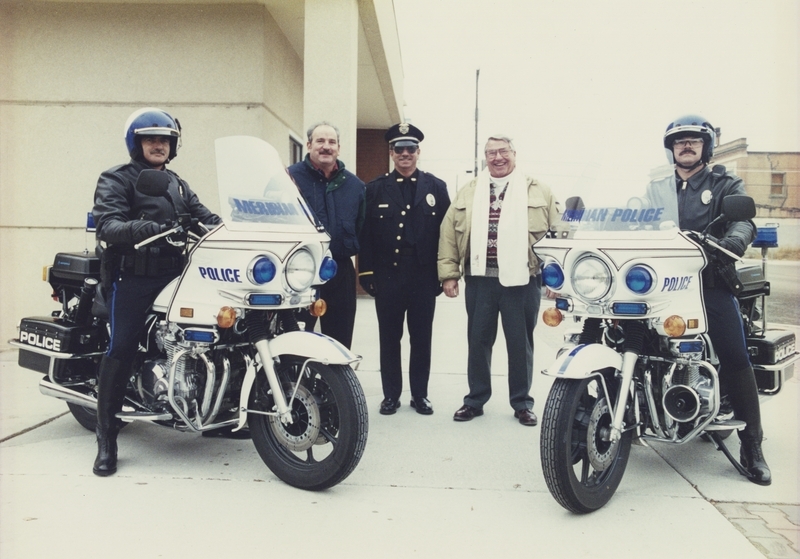 Meridian motorcycle officers Sergeant Gene Trakel and Rick Murphy, with three currently unidentified individuals in the middle of the photo. 