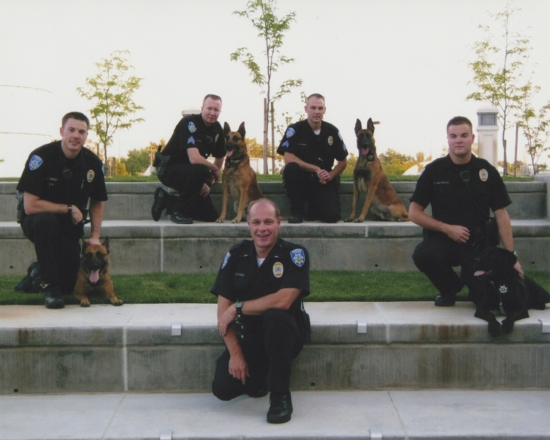 Four police K-9s with officers J. Lindley, J. Brown, B. Stokes, S. Washburn, S. Colaianni, circa 2010s