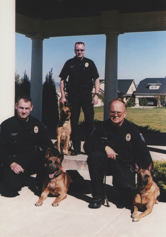 K-9 Officers B. Stokes, J. Brown, and unidentified officer, circa 2010s.