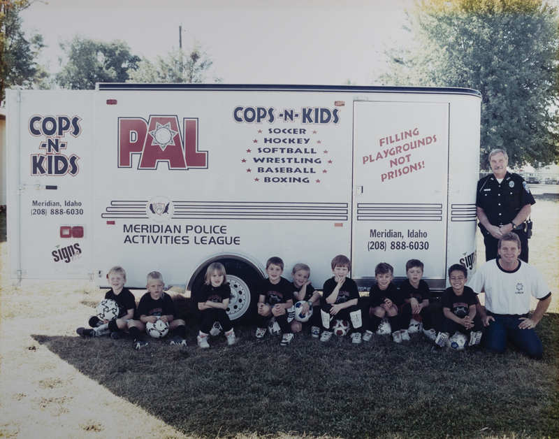 Meridian Police Officer Rick Shadduck with the PAL soccer team, 1997