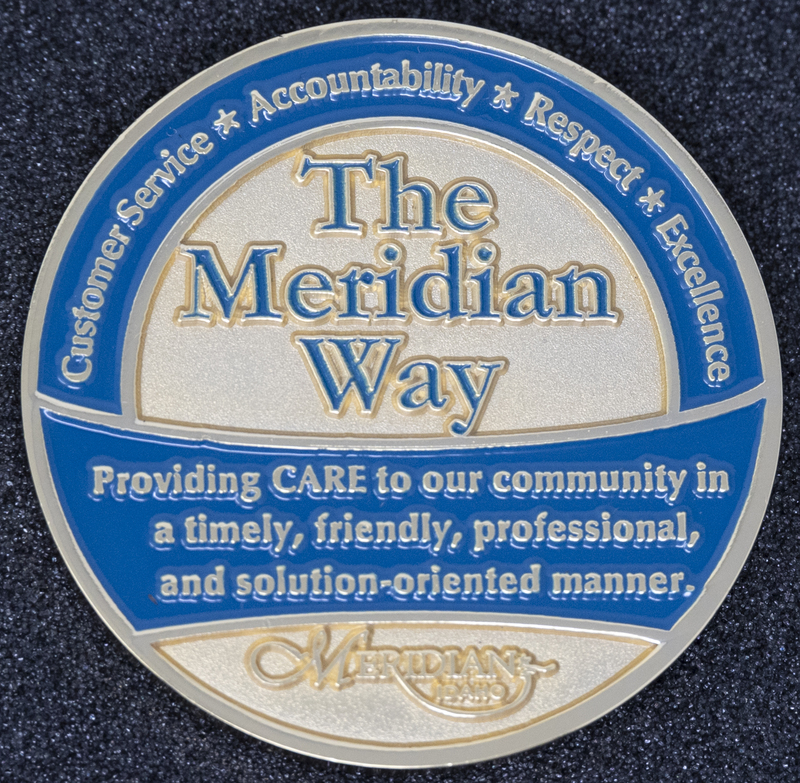 Meridian Police Coin 1-Back Side, circa 2007 or some time during Jeff Lavey's tenure as Meridian Police Chief. Back of coin focuses on four key police attributes that spell CARE: "Customer Service, Accountability, Respect, & Excellence." It states, "Providing CARE to our community in a timely, friendly, professional, and solution-oriented manner." 