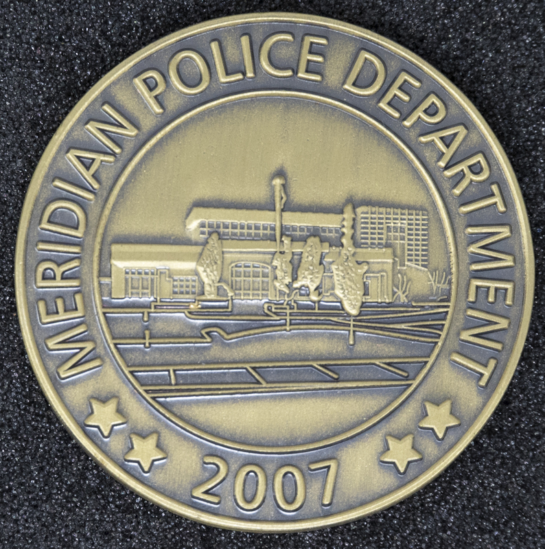 Meridian Police Coin 3-Front Side, 2007. Side of Coin contains a layout of the Meridian Police Department building.