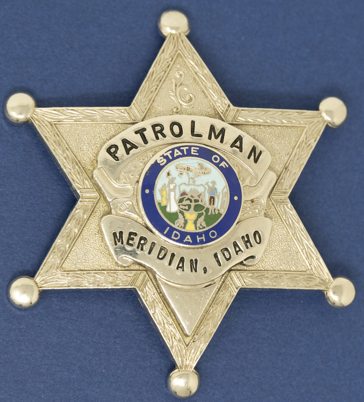 Meridian Patrolman Badge (Gold Star with color)-the badges with gold and colored Idaho seal show up later, this perhaps could be around the 1980s. 