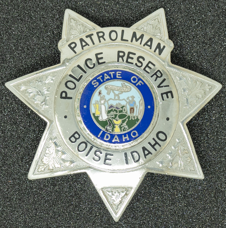 Boise Police Reserve Patrolman badge, part of MPD's Idaho patch and badge collection circa 2007. The patch and badge collection hangs on the MPD meeting room wall, and indicates the respect Meridian Police officers have for other police in the surrounding areas. 