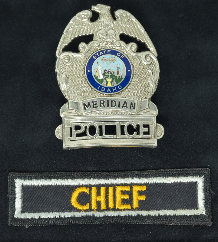 Gene Hiner Meridian Police badge and Chief patch. Hiner served as Meridian Police Chief from 1963-1973. Part of the Gene Hiner Police Career Display presented to the MPD by Gene Hiner's family.