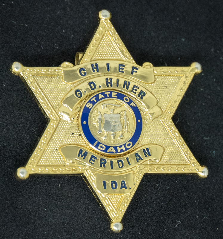 Gene Hiner Gold Meridian Police Chief badge. Hiner served as Meridian's police chief from 1963-1973. Part of the Gene Hiner Police Career Display presented to the MPD by Gene Hiner's family.