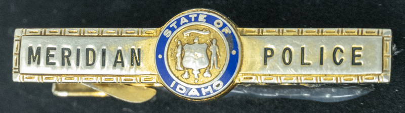 Gene Hiner Meridian Police tie clip, which could be from his officer service with the department from 1956-1958, or from 1963-1973 when he returned to the Meridian Police to serve as the Police Chief. Part of the Gene Hiner Police Career Display presented to the MPD by Gene Hiner's family. 