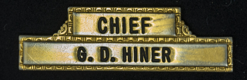 Gene Hiner Police Chief name tag, from Hiner's time as Meridian Police Chief, 1963-1973. Part of the Gene Hiner Police Career Display presented to the MPD by Gene Hiner's family. 