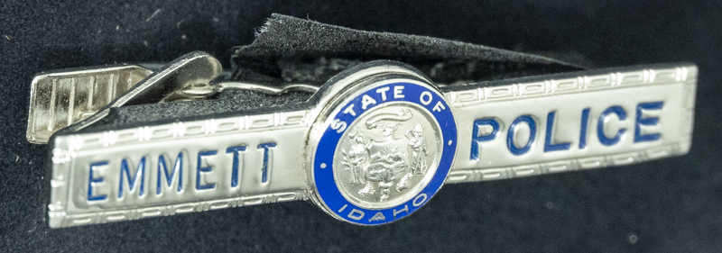 Gene Hiner Emmett Police tie clip, from Hiner's service in the Emmett Police Department in 1962. Part of the Gene Hiner Police Career Display presented to the MPD by Gene Hiner's family. 