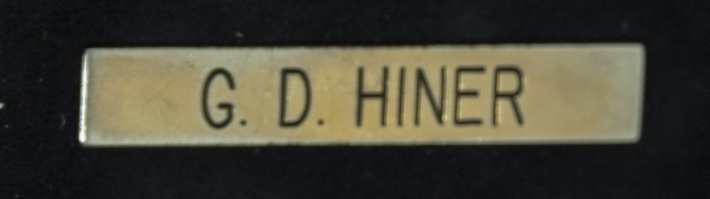 Gene Hiner name tag, which could have been used any time during his 1954-1973 police officer career. Part of the Gene Hiner Police Career Display presented to the MPD by Gene Hiner's family. 