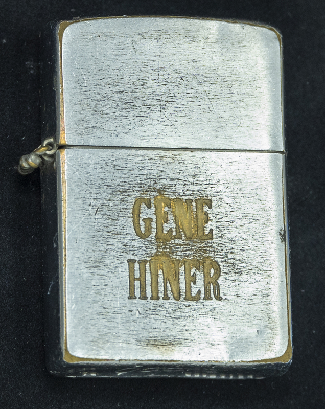 Gene Hiner engraved lighter, which could have been used any time during his 1954-1973 police officer career. Part of the Gene Hiner Police Career Display presented to the MPD by Gene Hiner's family. 