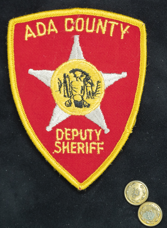 Gene Hiner Ada County Deputy Sheriff patch, from when Hiner served as a Deputy Sheriff in 1958. Part of the Gene Hiner Police Career Display presented to the MPD by Gene Hiner's family. 