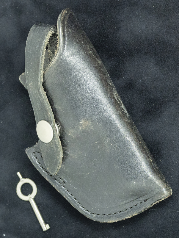 Gene Hiner handcuff key and baton sheath, which could have been used at anytime during his 1954-1973 police career. Part of the Gene Hiner Police Career Display presented to the MPD by Gene Hiner's family. 