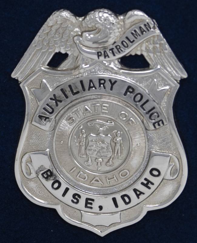 Boise Police Auxiliary Police Patrolman badge, part of MPD's Idaho patch and badge collection circa 2007. The patch and badge collection hangs on the MPD meeting room wall, and indicates the respect Meridian Police officers have for other police in the surrounding areas. 