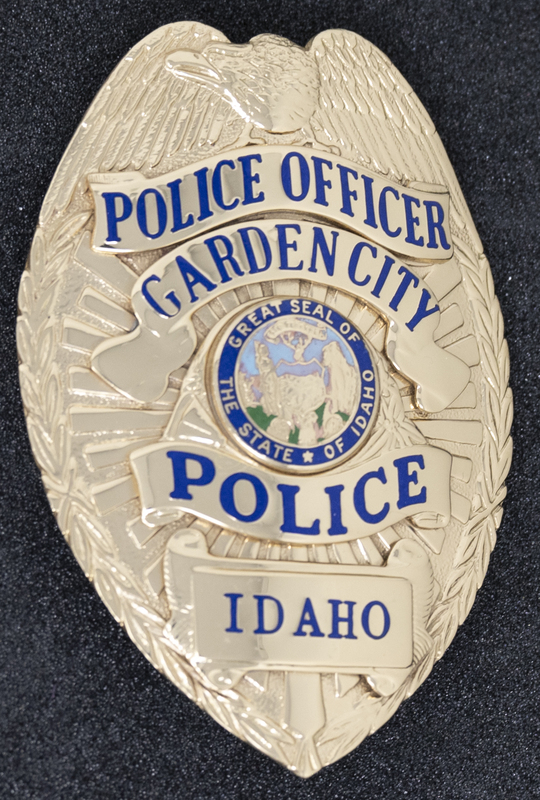 Garden City Police Officer badge, part of MPD's Idaho patch and badge collection circa 2007. The patch and badge collection hangs on the MPD meeting room wall, and indicates the respect Meridian Police officers have for other police in the surrounding areas. 