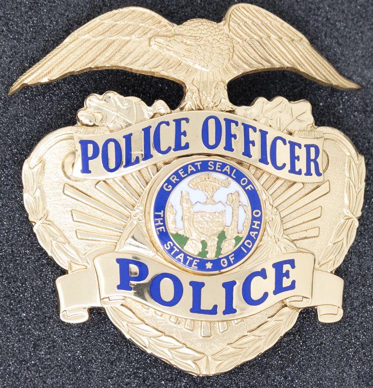 Garden City Police Officer badge, part of MPD's Idaho patch and badge collection circa 2007. The patch and badge collection hangs on the MPD meeting room wall, and indicates the respect Meridian Police officers have for other police in the surrounding areas.