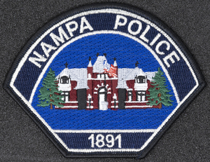 Nampa Police Department patch, part of MPD's Idaho patch and badge collection circa 2011. The patch and badge collection hangs on the MPD meeting room wall, and indicates the respect Meridian Police officers have for other police in the surrounding areas.