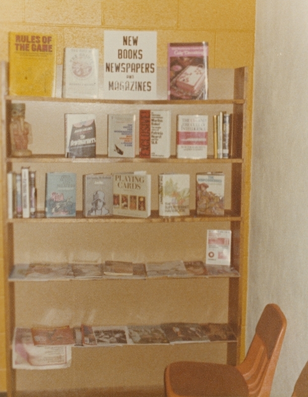 Meridian Library's New Books, Newspapers, and Magazines bookshelf, circa 1975.