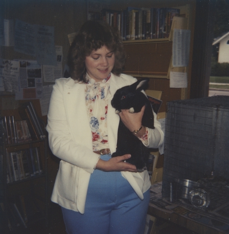 Meridian Library clerk-typist Roben Joy with "Baby" the rabbit. 