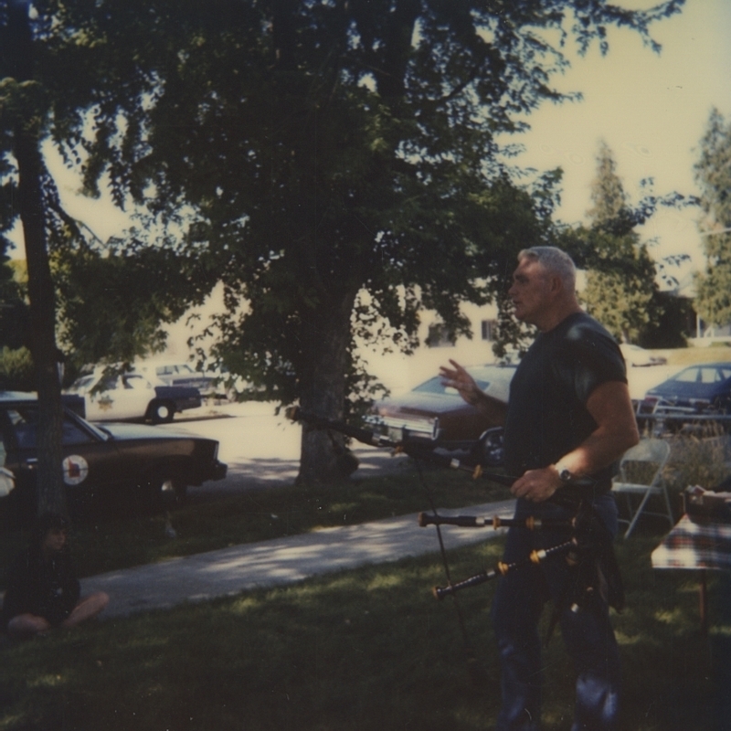 At a Summer Reading Program, George Early discusses the culture of Great Britian. George Early appears to be holding a set of bagpipes. 