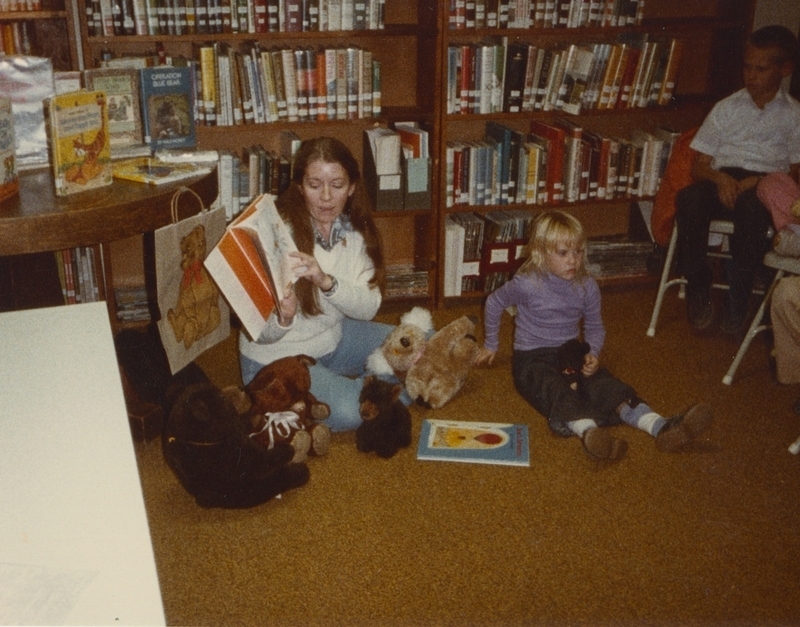 Librarian reading to children on "Good Bear Day" October 27, 1982. On Good Bear Day the children bring their teddy bears with them to the storytime.