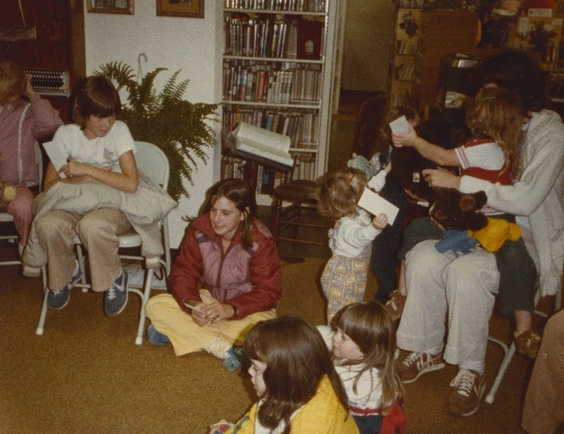 Several kids interact with Good Bear Day storytime, October 27, 1982. 