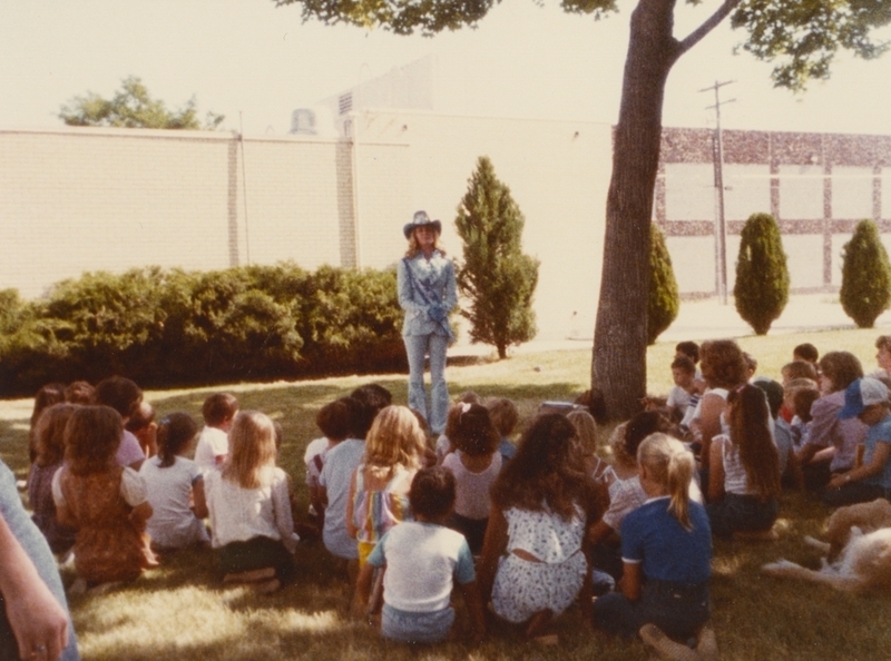 Myla Meiers addresses children at a Western themed library event. 