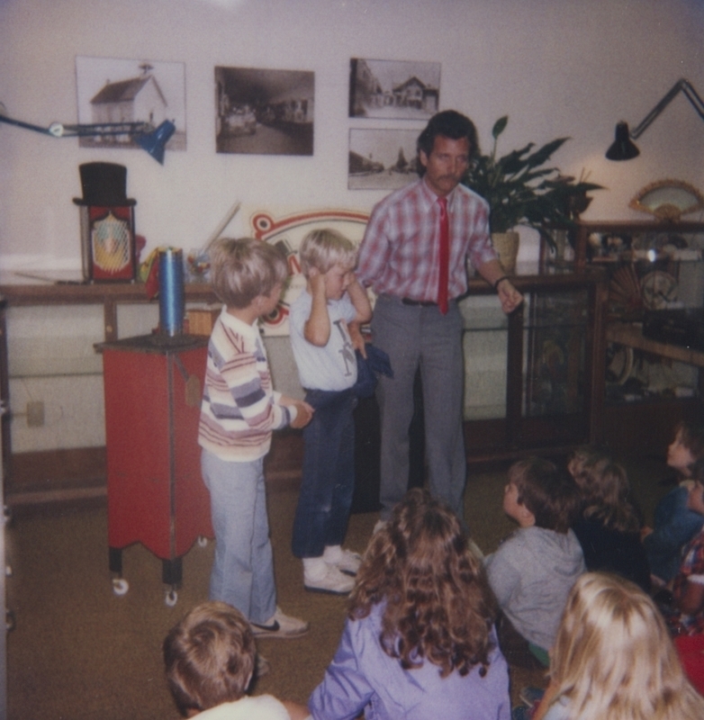 The Great Moodini recruits the assistance of audience members Jamie and Clark in his magic act at Meridian Library. 