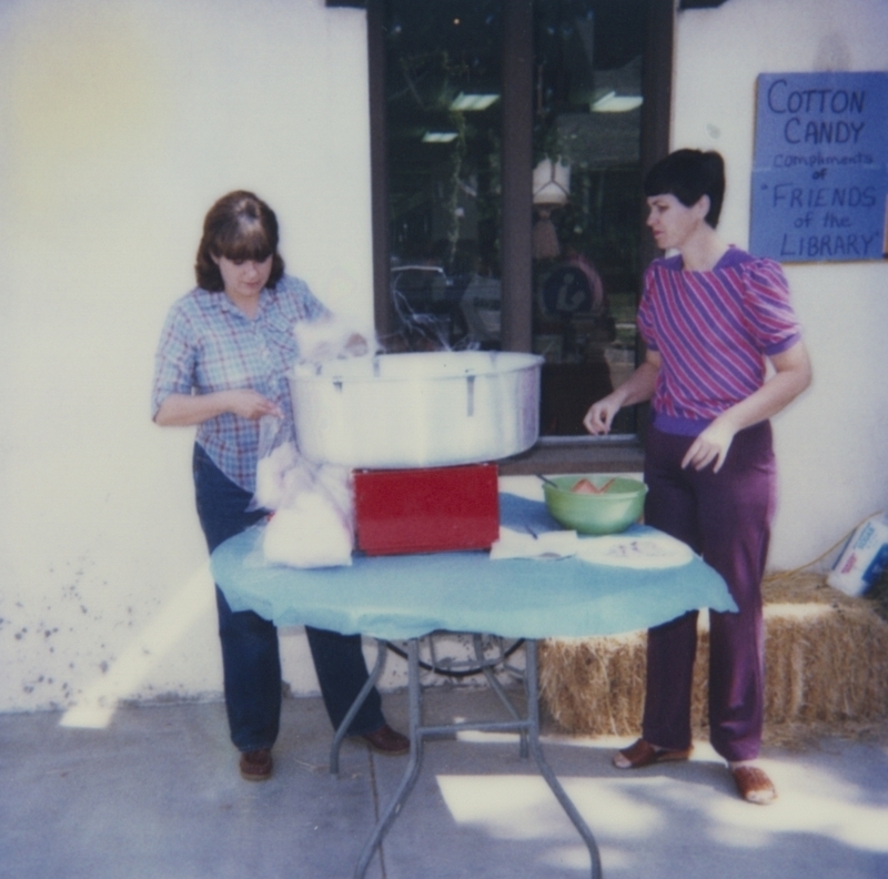 Della and Charline Smith make Cotton Candy as part of the last event for the Summer Reading Program. 