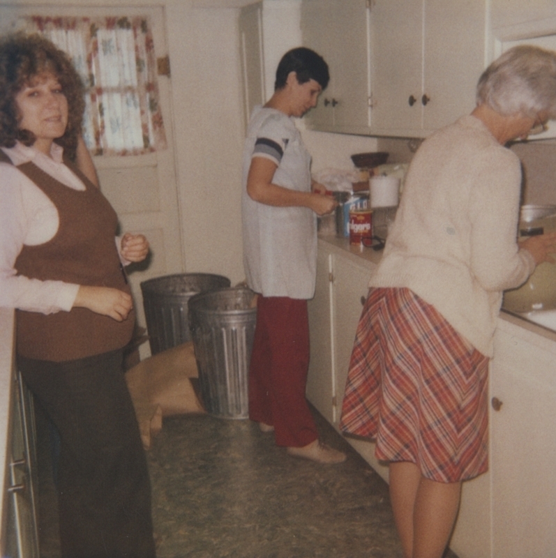 Workers gather in the library kitchen to prepare the food for the Library's Meal With a Peel fundraiser. 