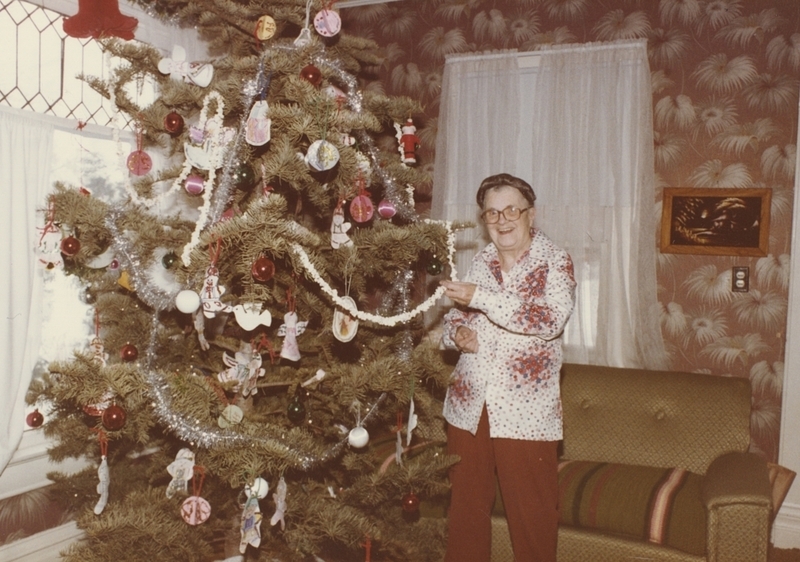 Former Meridian Public Librarian Nancy Sage enjoys the library's "Children's Tree" in her home. The tree is decorated with handmade paper ornaments made by children. 