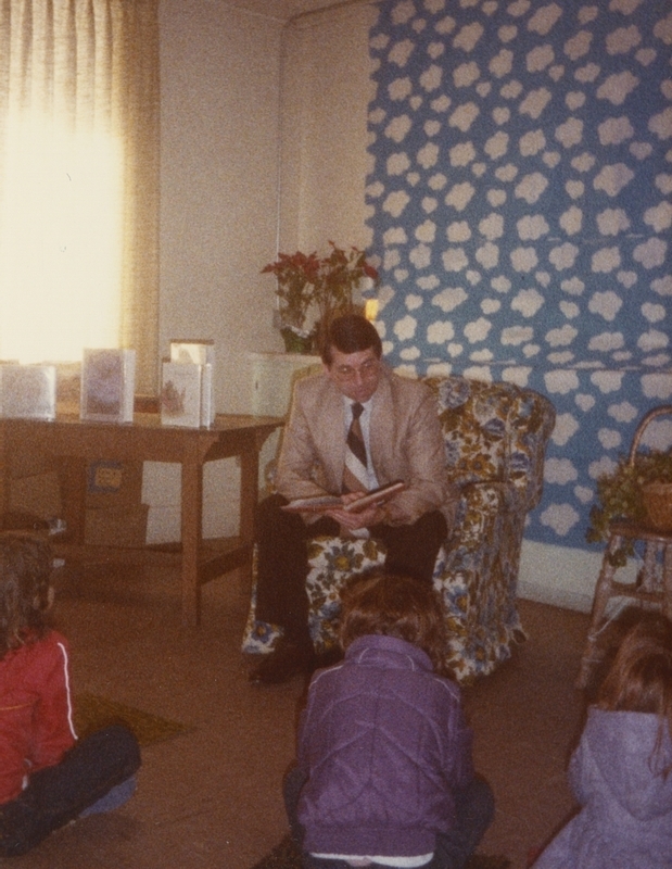 Representative Gary Montgomery reads to children during 1984's National Library Week events.