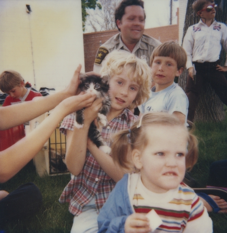 Bob Gregory of the Boise animal shelter brought along some friends to the Meridian Library for Be Kind to Animals Week. Here, the children look at and hold a kitten.