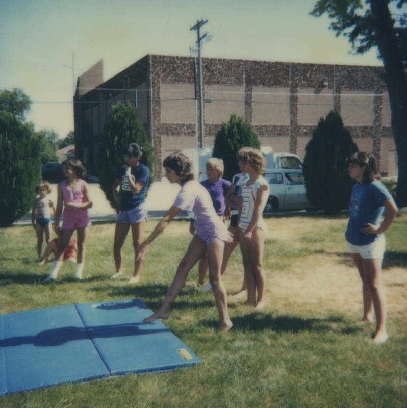 Girls from the Gem State Gymnastics Academy in Boise perform various gymnastics excercises as part of the library's Go For the Gold Summer Reading Program events.