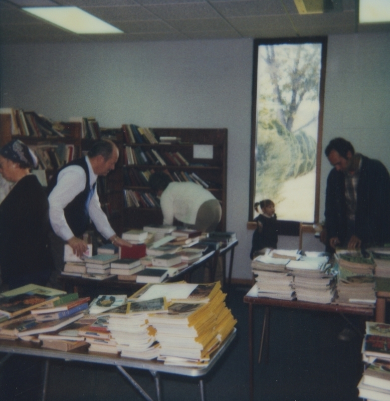 People browse the Meridian Library's book sale.