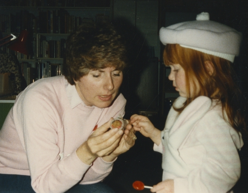 Suzanne D'Errico shows Andrea a small gift at a going away part for Suzanne as she heads to a new job in Washington. 