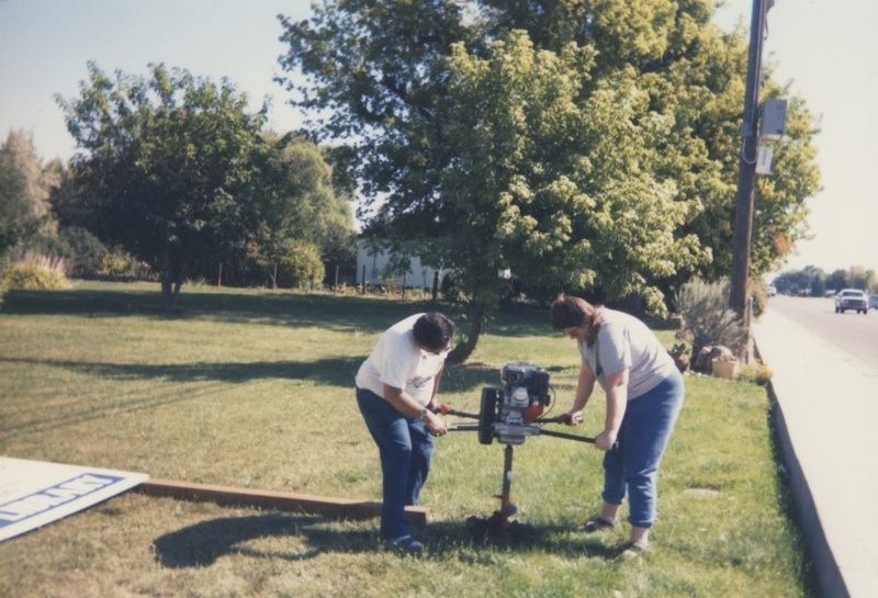 Drilling on newly purchased land for "Future Home of Meridian Library" sign. 