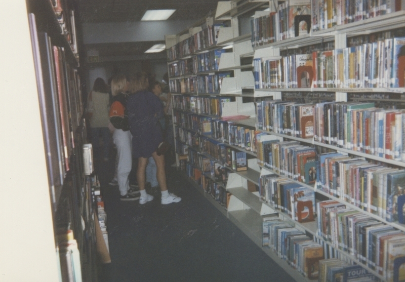 Patrons browse shelves at the old Meridian Library building on Idaho Street. This very year, plans were underway for a new and larger library to be built on Cherry Lane.