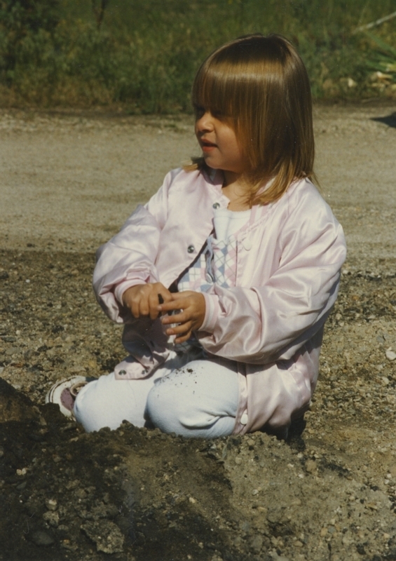 A little girl sits down prior to the Cherry Lane Library building ground breaking ceremony. 