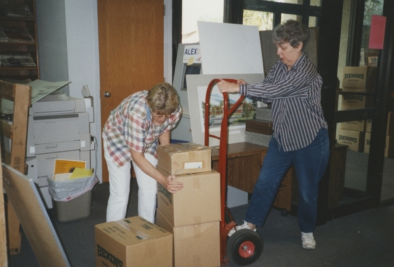 Meridian Library District workers loading packed boxes onto a hand trolley in the old Meridian libraryn building as they get ready to move to the newly built Cherry Lane Library.