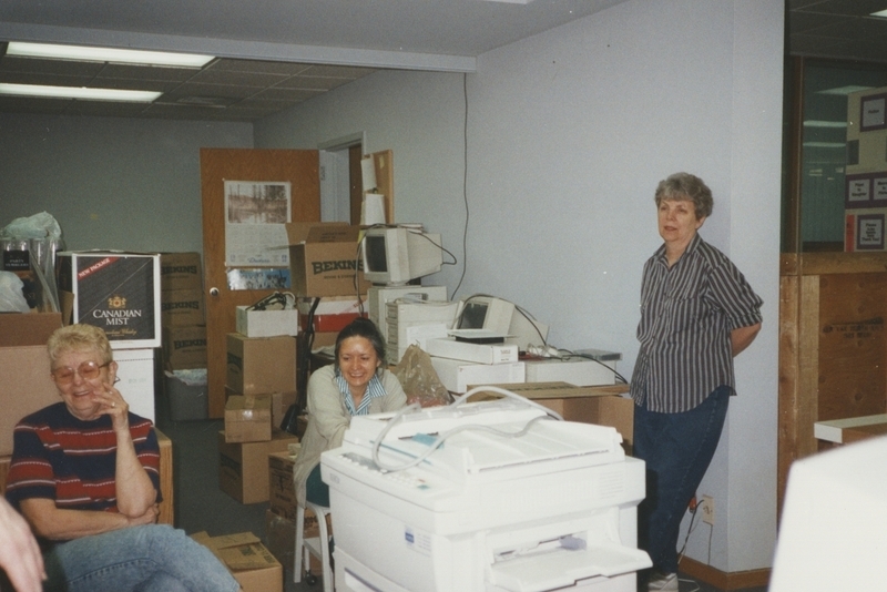 Meridian Library workers take a break from packing up boxes at the old Meridian library building prior to their move into the new Cherry Lane Library building.